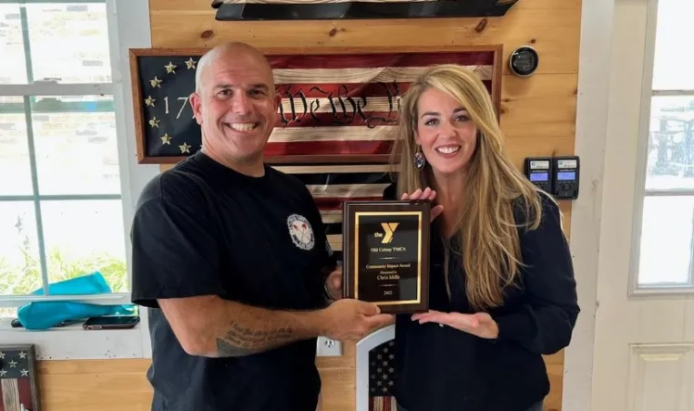 From left to right: Owner and Craftsman of Shovel Town Flag Company Chris Mills and Executive Director of Easton’s YMCA Darcy Paiva. 