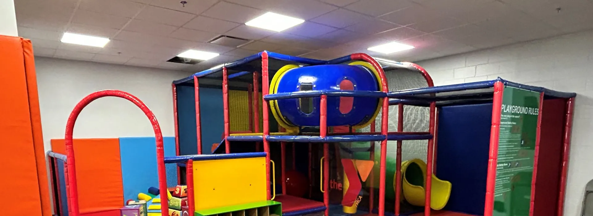 Super colorful playspace for kids with slides, soft blocks, and tunnels